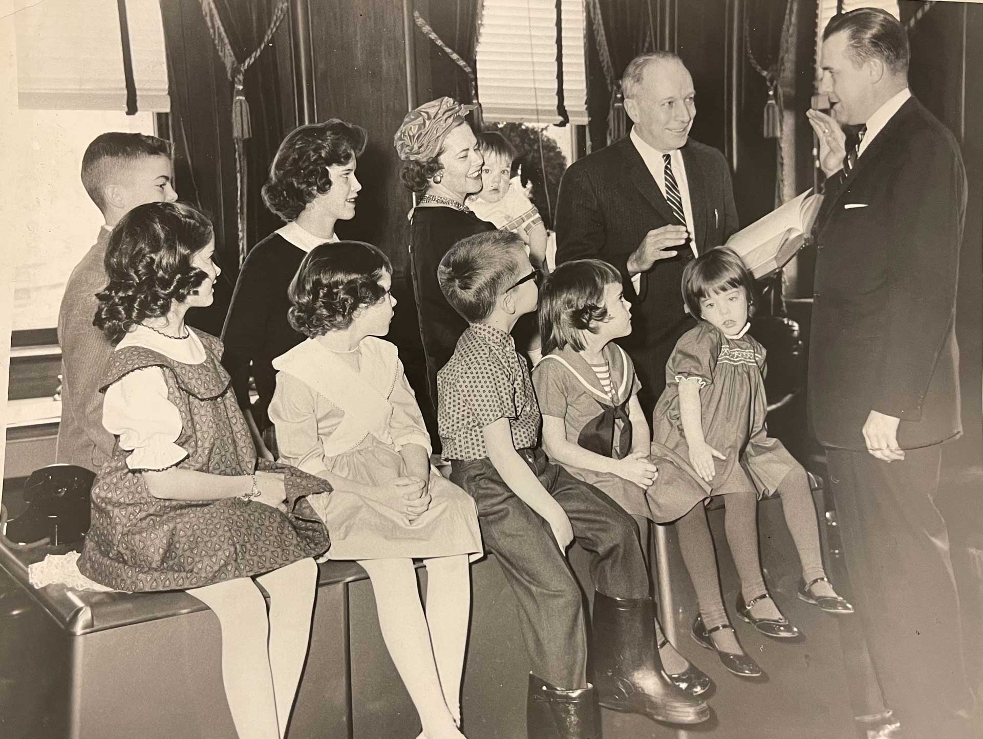 The Hon. John W. Rehfuss speaking to some children